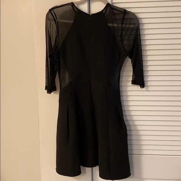 Black Sheer Peplum Dress with Chain Detail - Picture 4 of 4